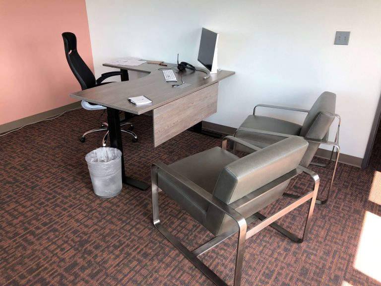 office with 3 seats and a desk