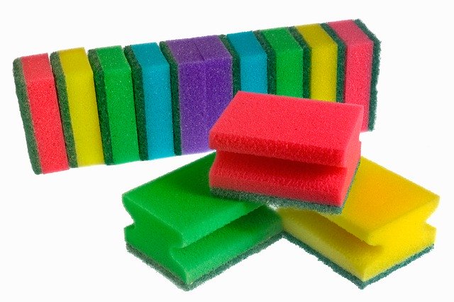 A selection of colorful sponges on a white background