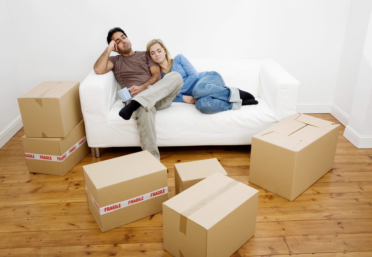Couple tired from moving into a new home