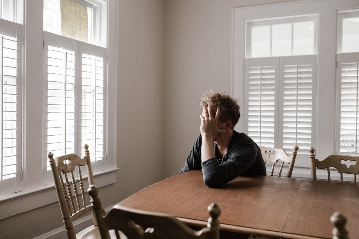 Man thinking in dining room